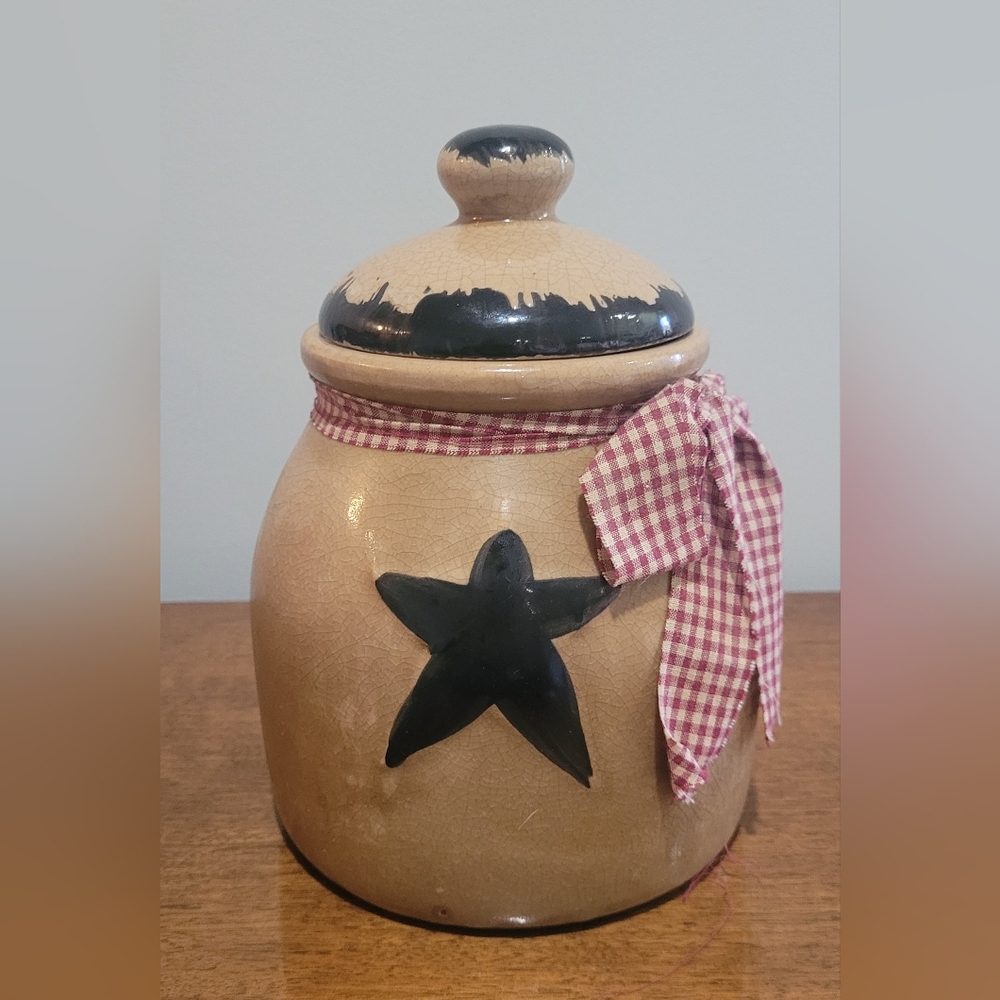 Handmade 8" Crackle Painted Black Star Pottery Canister with Red Checkered Bow.